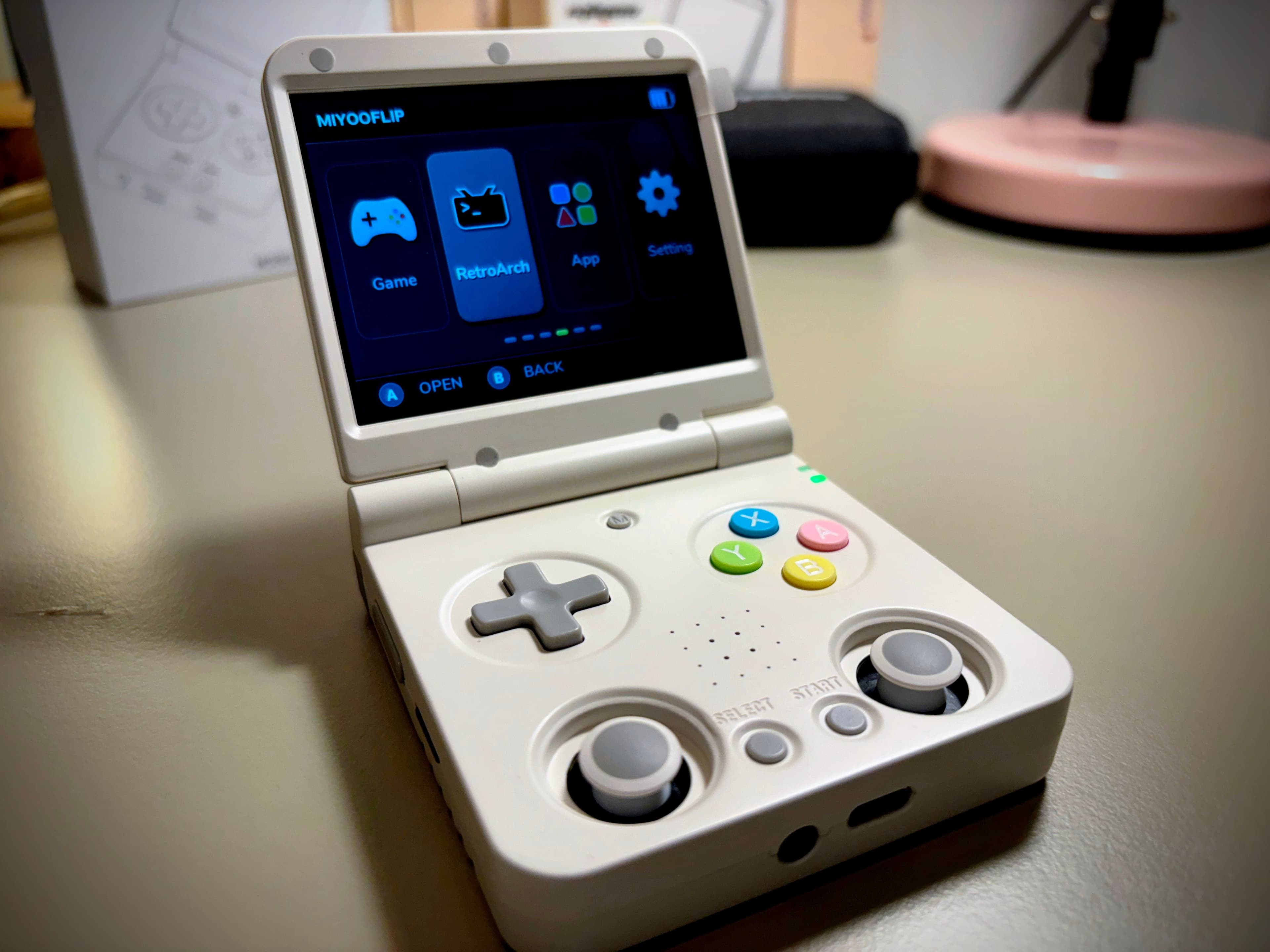 Grey Miyoo Mini Flip with coloured buttons.